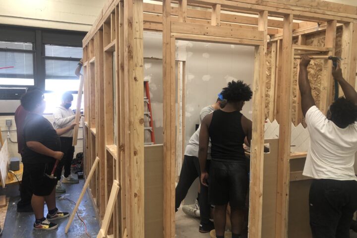 Students in Mr Smith's Construction Trades class learn the basics of framing.